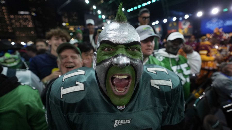 Associated Press - A Philadelphia Eagles fan cheers during the first round of the NFL football draft, Thursday, April 25, 2024, in Detroit. (AP Photo/Paul Sancya)