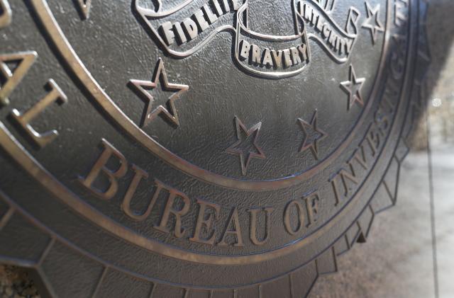 The crest for the Department of Justice, Federal Bureau of Investigations is seen on the outside of the J. Edgar Hoover FBI Building in Washington, U.S., March 12, 2019. REUTERS/Leah Millis