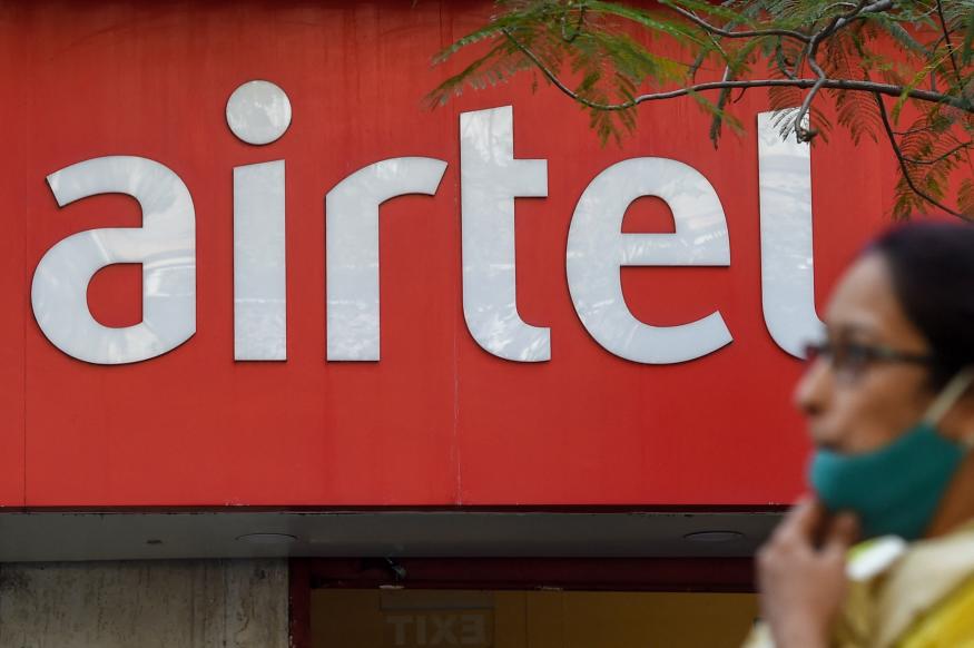 A pedestrian walks past a shop of Indias second-largest mobile operator Airtel in Mumbai on January 28, 2022. - Google will invest up to $1 billion in India's second-largest mobile operator, Airtel, the companies said on January 28, as the Android-maker looks to bolster its presence in the vast nation's booming telecoms market. (Photo by Punit PARANJPE / AFP) (Photo by PUNIT PARANJPE/AFP via Getty Images)