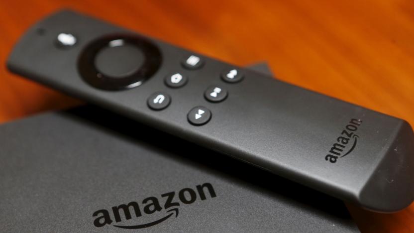 The new Amazon Fire TV is displayed during a media event introducing new Amazon products in San Francisco, California September 16, 2015. Amazon on Thursday rolled out a line of tablets and revamped Fire TV gadgets. The $99.99 Fire TV set-top box integrates its cloud-based virtual assistant Alexa, allowing viewers to check the weather, look up sports scores and play music. Photo taken September 16, 2015.  REUTERS/Beck Diefenbach