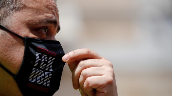 Taxi driver and union member Tito Alvarez adjusts his mask as he attends a protest against the regulation of VTC cars (Uber and Cabify) in Barcelona, Spain, May 20, 2021. REUTERS/Albert Gea