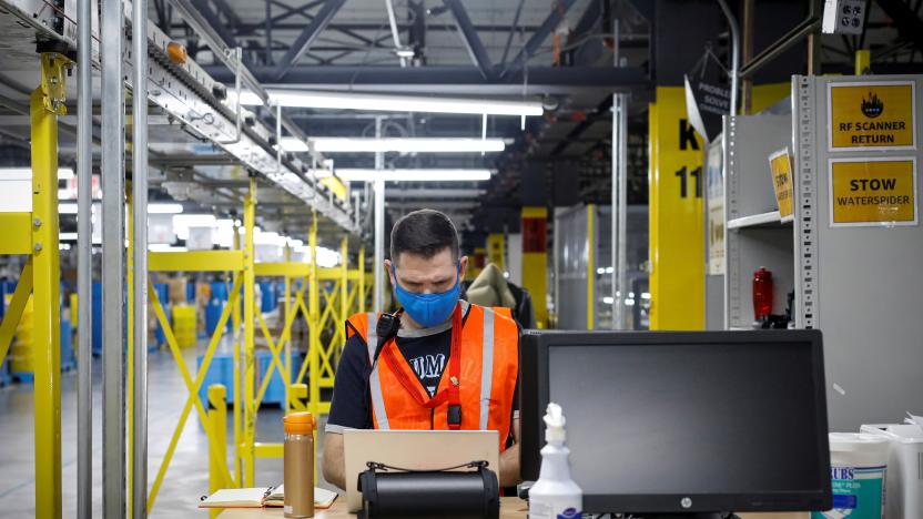 An employee works at Amazon's JFK8 distribution center in Staten Island, New York, U.S. November 25, 2020.  REUTERS/Brendan McDermid.