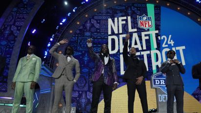 Associated Press - Top prospects stand on stage before the first round of the NFL football draft, Thursday, April 25, 2024, in Detroit. (AP Photo/Jeff Roberson)