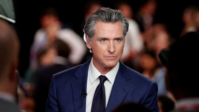 FILE PHOTO: California Governor Gavin Newsom (D) reacts as he speaks to the members of the press on the day of the first presidential debate hosted by CNN in Atlanta, Georgia, U.S., June 27, 2024. REUTERS/Marco Bello/File Photo