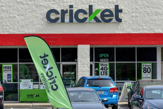 Wilson, NC / March 29, 2018: A Cricket sign is displayed above the entrance to their retail store in Wilson, North Carolina.