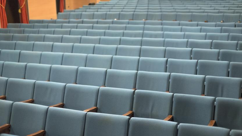 Inside a cinema in Bologna, in the Bolognina district, with seats for the spectators and the empty room