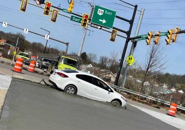 Wet concrete stops driver who drove around barriers