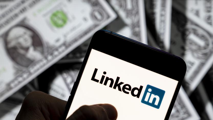 CHINA - 2021/04/23: In this photo illustration the business and employment oriented network and platform LinkedIn logo seen displayed on a smartphone with USD (United States dollar) currency in the background. (Photo Illustration by Budrul Chukrut/SOPA Images/LightRocket via Getty Images)