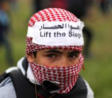 Palestinians mass at Gaza border to mark protest anniversary