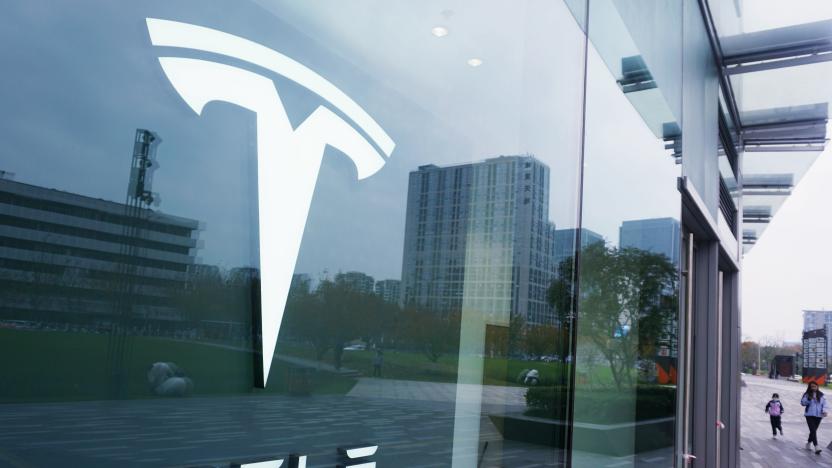 HANGZHOU, CHINA - NOVEMBER 27, 2022 - Customers walk past a Tesla store in Hangzhou, Zhejiang province, China, Nov 27, 2022. [Photo/IC] Tesla Inc has recalled 80,561 imported Model S and Model X electric cars and some imported and domestically produced Model 3 electric cars, the State Administration for Market Regulation announced. (Photo credit should read CFOTO/Future Publishing via Getty Images)