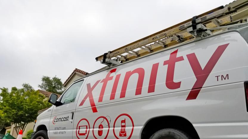 San Ramon, California, United States - May 17, 2018:  Low angle view of Comcast Xfinity cable television installation truck parked on a street in front of a suburban home, San Ramon, California, May 17, 2018