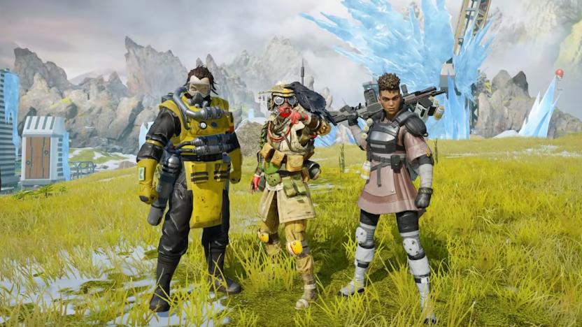 Three characters from Apex Legends Mobile look toward the camera while standing on a hill.. There are some buildings and an ice formation in the background.