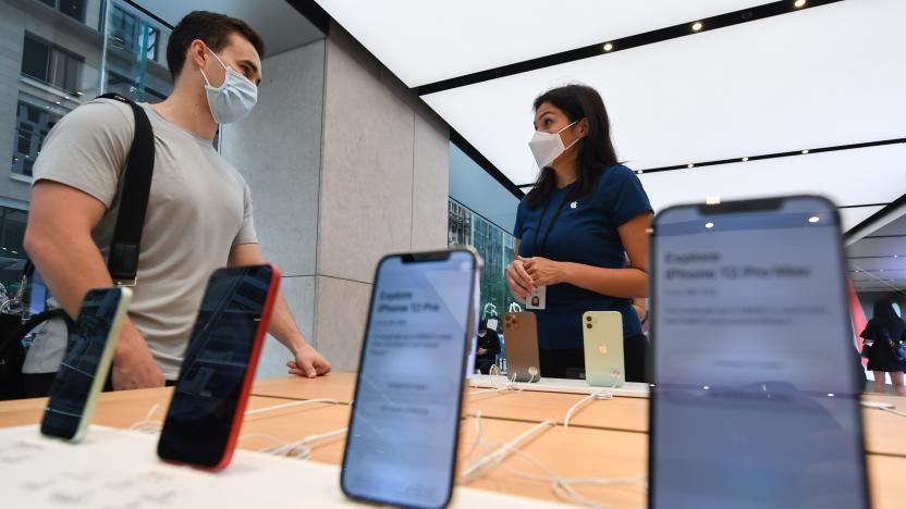 SYDNEY, AUSTRALIA - NOVEMBER 13: Customers looking at the new products on sale inside the Apple Store on George Street on November 13, 2020 in Sydney, Australia. The new iPhone 12 Pro Max and iPhone 12 Mini went on sale at 8am this morning allowing customers in Australia to be amongst the first in the world to obtain the new device.  (Photo by James D. Morgan/Getty Images)