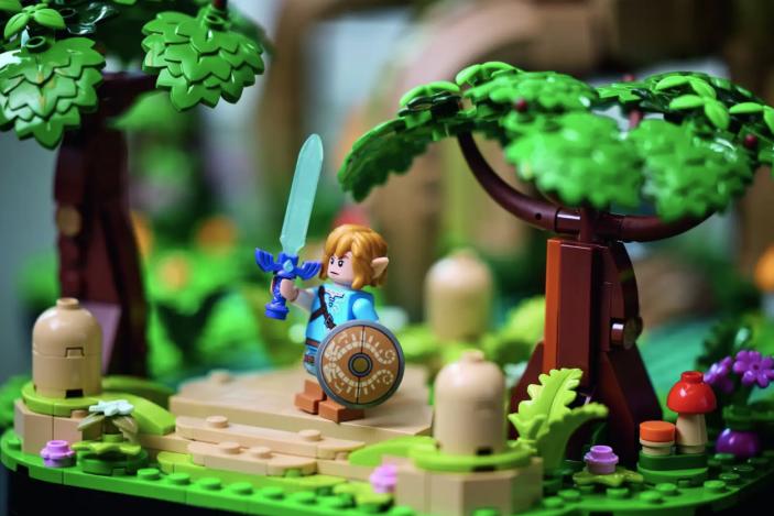 Lego Link holding up the Master Sword.