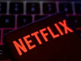 Netflix slips after stopping subscriber tally report, downbeat Q2 revenue forecast