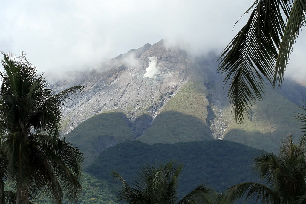 Hundreds flee rumbling Philippines volcano typhoon