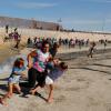 U.S. closes Mexican border crossing, repels some migrants with tear gas