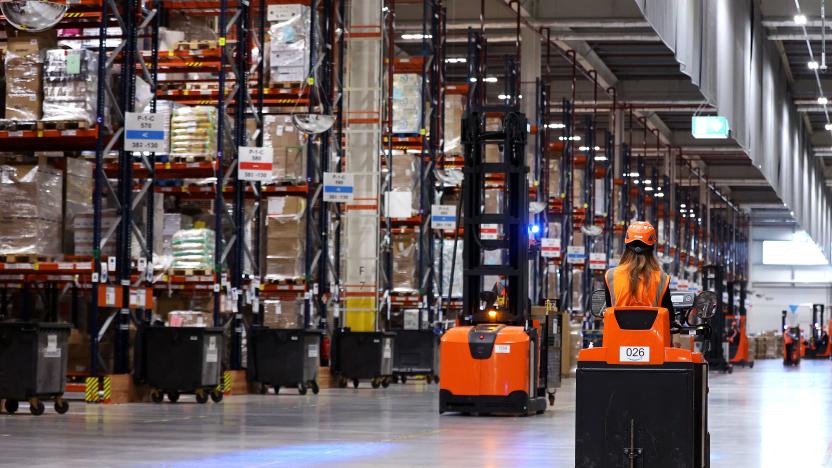 Employees work at the Amazon logistics centre in Suelzetal near Magdeburg, eastern Germany, on Mai 12, 2021. - The US online sales giant had opened the new warehouse in Saxony-Anhalt in August 2020. (Photo by Ronny Hartmann / AFP) (Photo by RONNY HARTMANN/AFP via Getty Images)