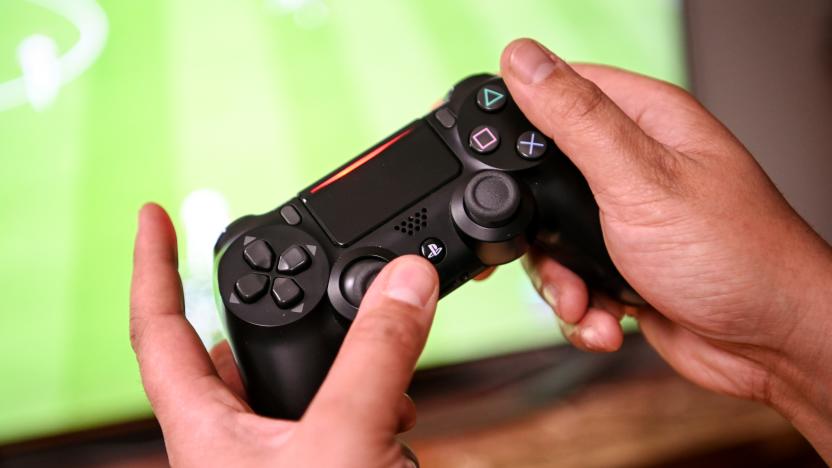 02 April 2020, Berlin: A young man plays with the game console Playstation 4. to prevent infection with the corona virus, many people spend their free time at home. Photo: Britta Pedersen/dpa-Zentralbild/dpa (Photo by Britta Pedersen/picture alliance via Getty Images)