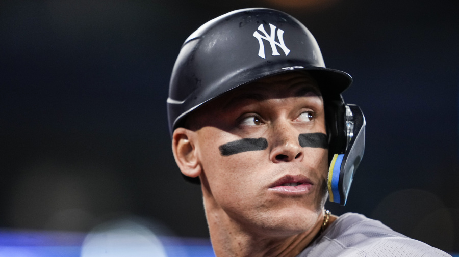 Getty Images - TORONTO, ON - APRIL 15: Aaron Judge #99 of the New York Yankees looks on against the Toronto Blue Jays during the third inning in their MLB game at the Rogers Centre on April 15, 2024 in Toronto, Ontario, Canada. All players are wearing the number 42 in honor of Jackie Robinson Day. (Photo by Mark Blinch/Getty Images)