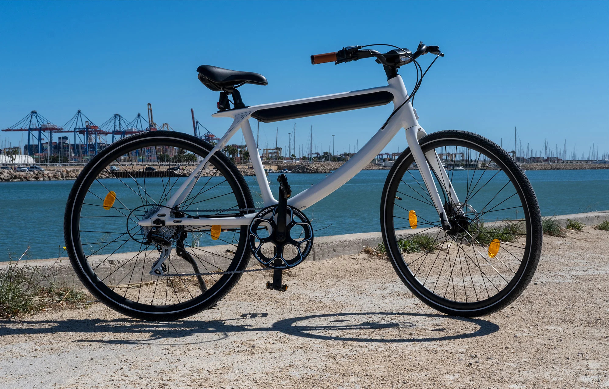 Urtopia's "Chord" e-bike is pictured on a harborside.