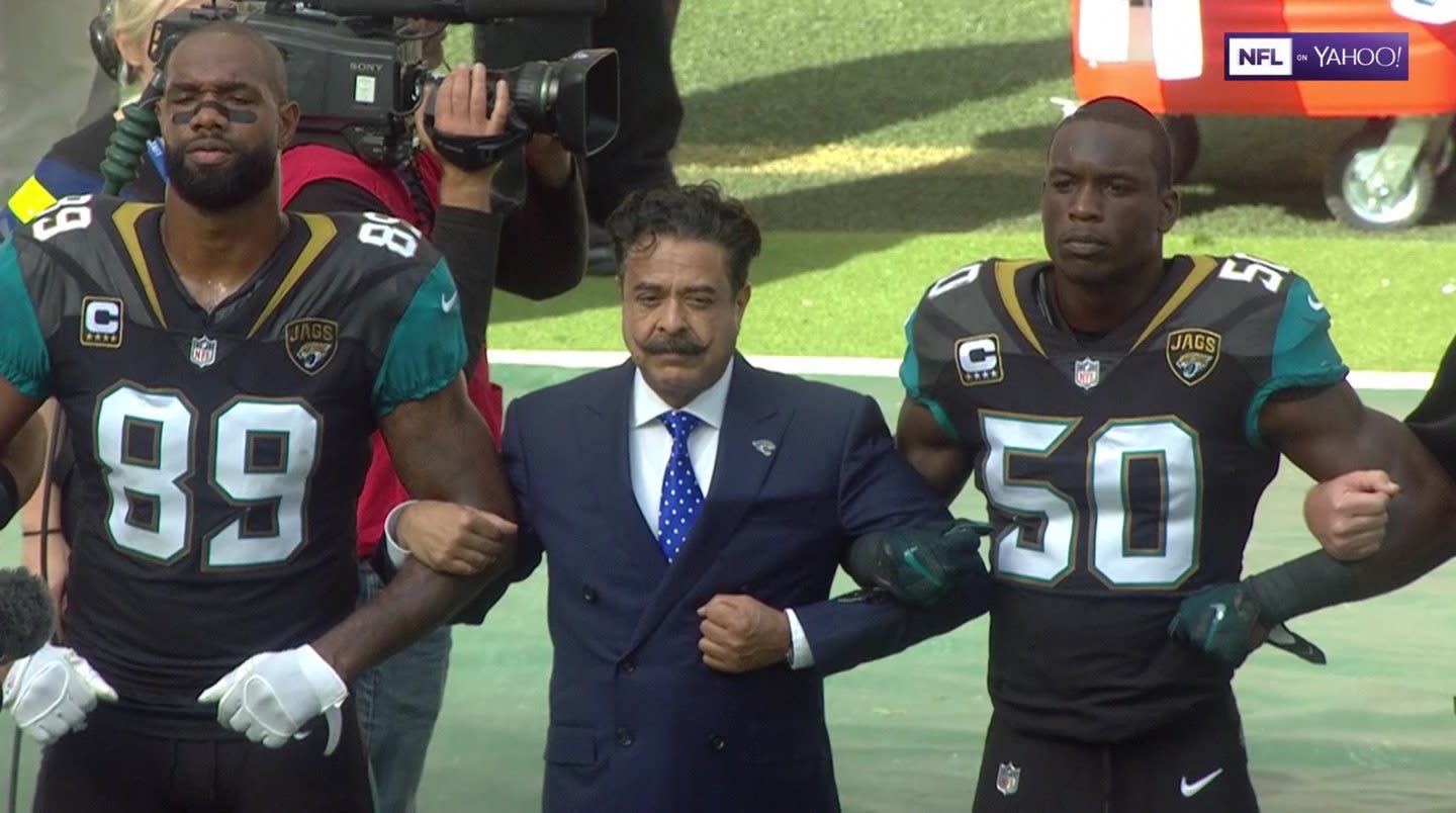 NFL Players Lock Arms, Kneel During National Anthem to Protest Trump