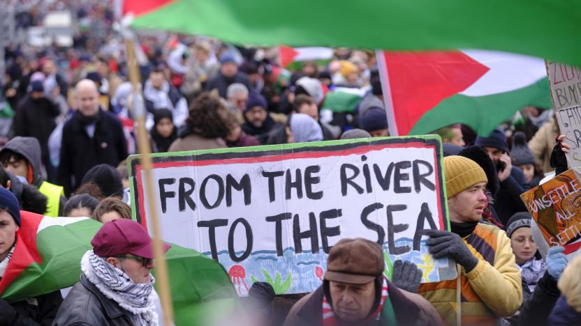 BRUSSELS, BELGIUM - JANUARY 21: About 9,000 people take part in a demonstration between the 'Gare du Nord' and the 'Place Jean Rey' on January 21, 2024, in Brussels, Belgium. People hold a placard with 'From the river to the sea » written. A national march bringing together around 9,000 people (according to figures from the Brussels-Capital) was held this Sunday afternoon to demand from Belgium "concrete actions to obtain a ceasefire in Gaza and ensure justice for the Palestinian people." (Photo by Thierry Monasse/Getty Images)