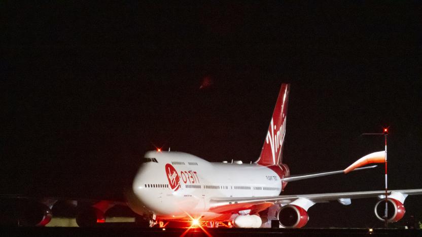 NEWQUAY, ENGLAND - JANUARY 09: A general view of Cosmic Girl, a repurposed Boeing 747 aircraft carrying the LauncherOne rocket under its left wing, as final preparations are made at Cornwall Airport Newquay on January 9, 2023 in Newquay, United Kingdom. Virgin Orbit launches its LauncherOne rocket from the spaceport in Cornwall, marking the first ever orbital launch from the UK. The mission has been named Start Me Up after the Rolling Stones hit. (Photo by Matthew Horwood/Getty Images)