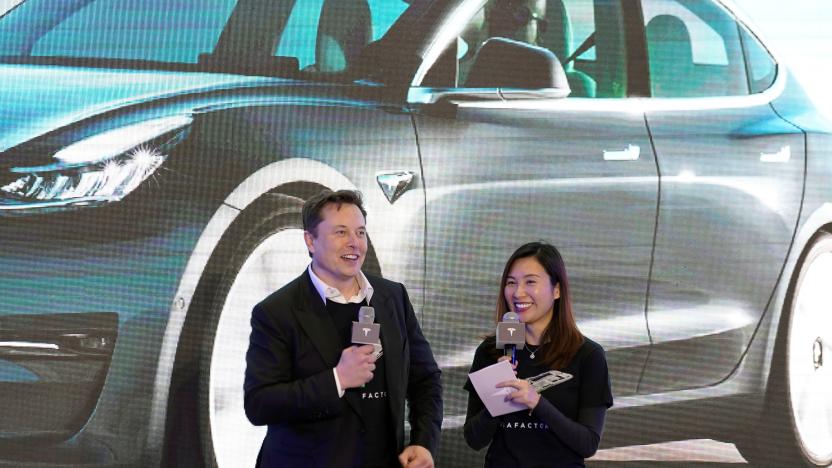 Tesla Inc CEO Elon Musk and Grace Tao, Tesla's vice president for external relations, attend a delivery ceremony for the electric vehicle (EV) maker's China-made Model 3 cars in Shanghai, China January 7, 2020. Picture taken January 7, 2020. REUTERS/Aly Song