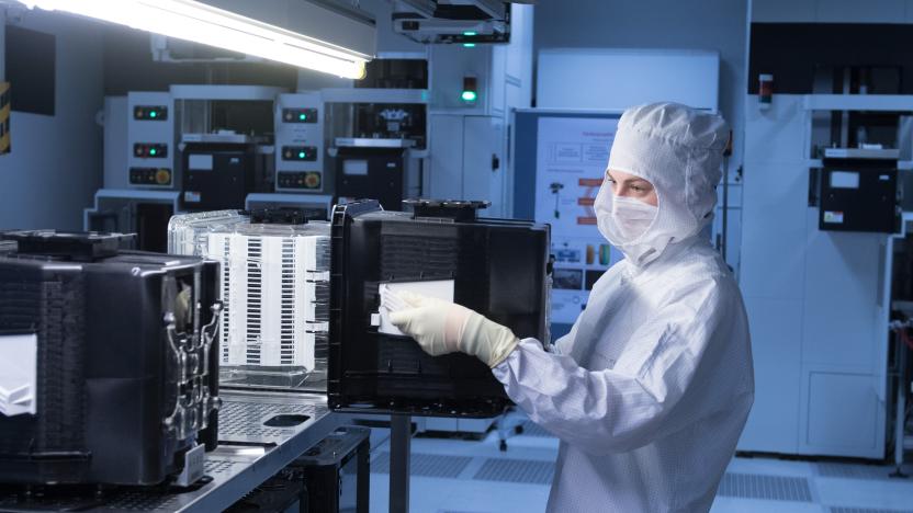 19 March 2019, Saxony, Dresden: Lisa Marie Eisner, a trainee microtechnologist, is wearing a plastic housing for transporting silicon wafers in an automation laboratory of the chip manufacturer Globalfoundries (GF). An external meeting of the Saxon cabinet with a focus on digitisation will take place on Tuesday at Globalfoundries. Photo: Sebastian Kahnert/dpa-Zentralbild/dpa (Photo by Sebastian Kahnert/picture alliance via Getty Images)