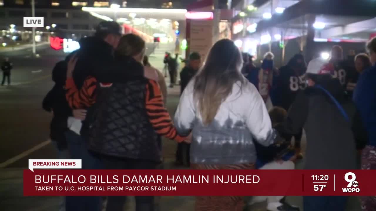 Bills, Bengals fans join in prayer outside Cincinnati hospital