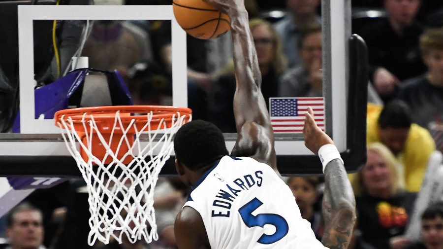 Getty Images - SALT LAKE CITY, UTAH - MARCH 18: Anthony Edwards #5 of the Minnesota Timberwolves dunks over John Collins #20 of the Utah Jazz during the second half of a game at Delta Center on March 18, 2024 in Salt Lake City, Utah. NOTE TO USER: User expressly acknowledges and agrees that, by downloading and or using this photograph, User is consenting to the terms and conditions of the Getty Images License Agreement.  (Photo by Alex Goodlett/Getty Images)