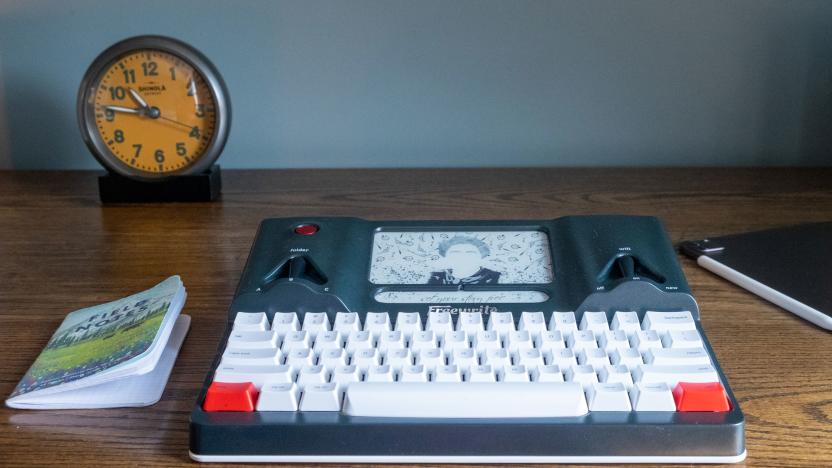 The Freewrite standalone word processor with keyboard sits on an office desktop.