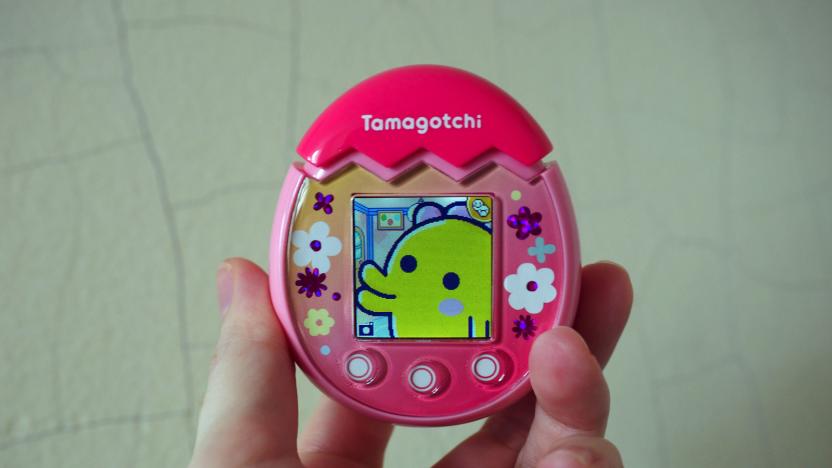 Pink Tamagotchi Pix with a yellow creature on the screen