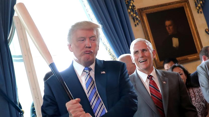 Vice President Mike Pence laughs as U.S. President Donald Trump holds a baseball bat as they attend a Made in America product showcase event at the White House in Washington, U.S., July 17, 2017. REUTERS/Carlos Barria      TPX IMAGES OF THE DAY