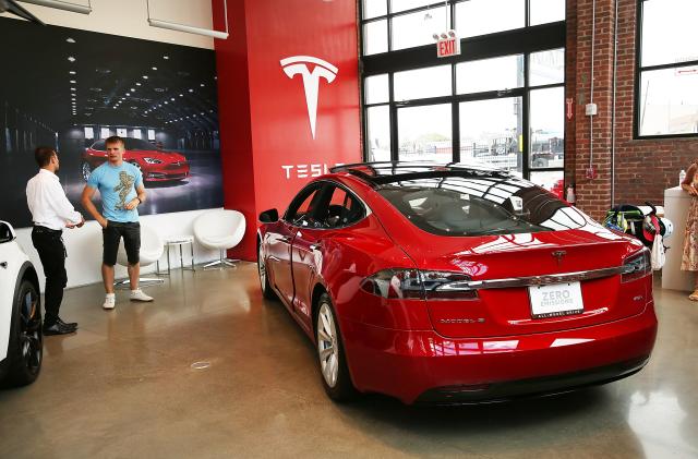 NEW YORK, NY - JULY 05:  A Tesla model S sits parked in a new Tesla showroom and service center in Red Hook, Brooklyn on July 5, 2016 in New York City. The electric car company and its CEO and founder Elon Musk have come under increasing scrutiny following a crash of one of its electric cars while using the controversial autopilot service. Joshua Brown crashed and died in Florida on May 7 in a Tesla car that was operating on autopilot, which means that Brown's hands were not on the steering wheel.  (Photo by Spencer Platt/Getty Images)