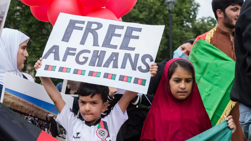 LONDON, UNITED KINGDOM - AUGUST 18, 2021: Demonstrators including former interpreters for the British Army in Afghanistan protest in Parliament Square against Taliban and demand human rights in Afghanistan as MPs hold a debate on the crisis in Afghanistan in the House of Commons on August 18, 2021 in London, England. The British Parliament has been recalled for one day from summer recess as the Taliban regained control over Afghanistan and its capital Kabul in recent days following the withdrawal of international troops and the collapse of the Western-backed Afghan government. (Photo credit should read Wiktor Szymanowicz/Barcroft Media via Getty Images)