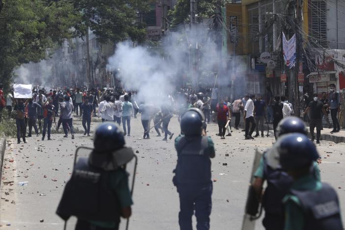Students clash with riot police during a protest against a quota system for government jobs, in Dhaka, Bangladesh, Thursday, July 18, 2024. (AP Photo/Rajib Dhar)