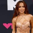 Anitta flashes her bum in fishnet cut-out shorts & sparkly thong