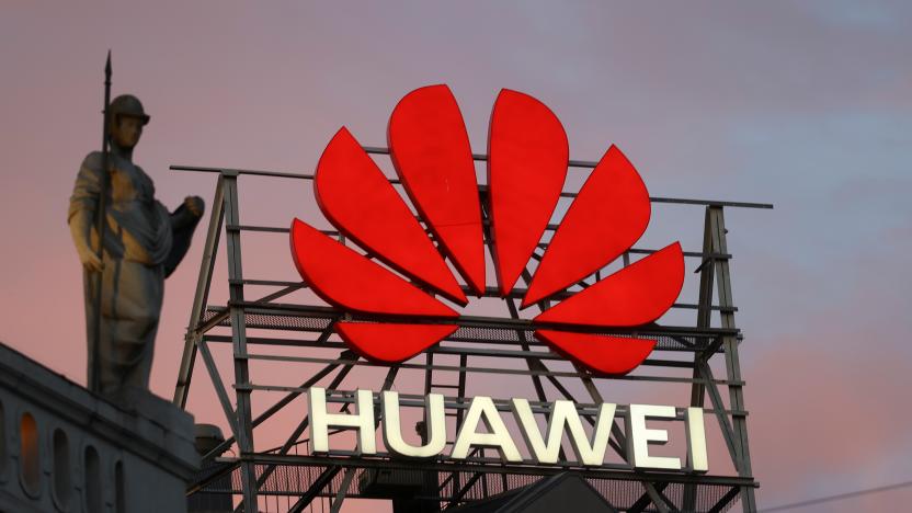 The logo of the Chinese telecommunications giant Huawei Technologies is pictured next to a statue on top of a building in Copenhagen, Denmark, June 23, 2021. REUTERS/Wolfgang Rattay