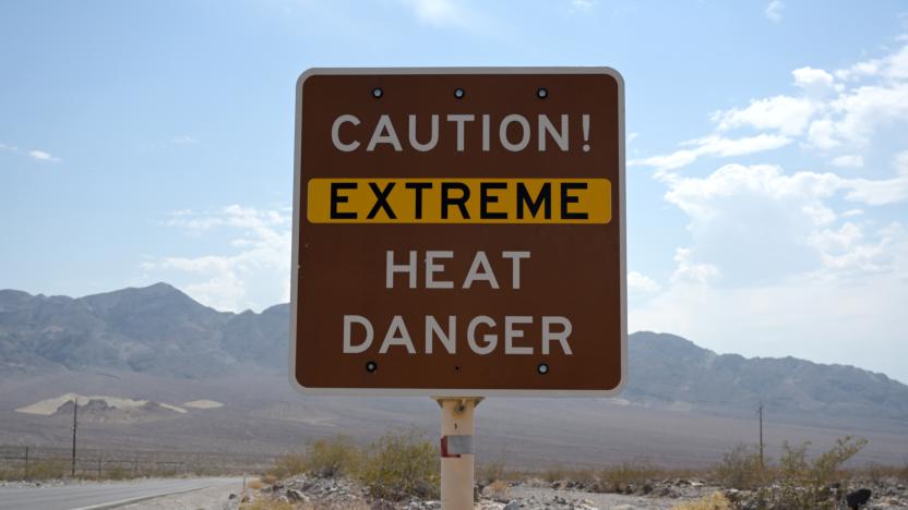 A sign warns of extreme heat in Death Valley, California, U.S., July 11, 2021. REUTERS/Bridget Bennett