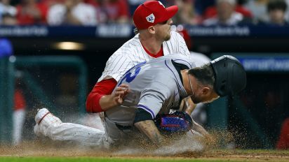 Getty Images - PHILADELPHIA, PENNSYLVANIA - APRIL 15: Pitcher Jeff Hoffman #23 of the Philadelphia Phillies tags out pinch runner Kyle Freeland #21 of the Colorado Rockies who was attempting to score on a wild pitch in the 10th inning of a game at Citizens Bank Park on April 15, 2024 in Philadelphia, Pennsylvania. The Phillies defeated the Rockies 2-1. All players are wearing the number 42 in honor of Jackie Robinson Day. (Photo by Rich Schultz/Getty Images)