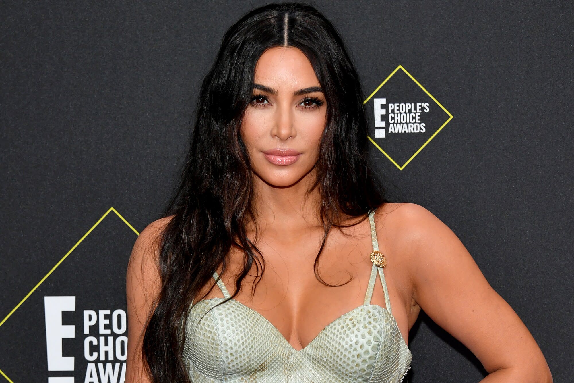 Kim Kardashian Teases Blonde Locks and Bleached Eyebrows Before Going 'Back  to Dark'