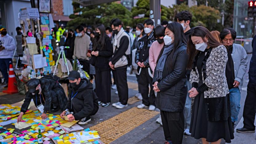 People cry during tribute for the victims of the Halloween disasters in Itaewon on November 3, 2022 in Seoul, South Korea. According to the National Fire Agency 156 have been reported killed and at least 187 others were injured.