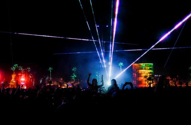 Festival goers watch Swedish House Mafia perform at the Coachella Valley Music and Arts Festival held at the Empire Polo Club in Indio, California, U.S., April 24, 2022. Picture taken April 24, 2022. REUTERS/Maria Alejandra Cardona