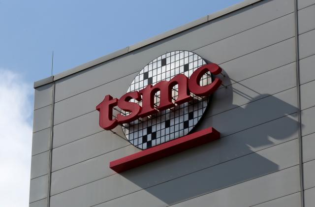 A logo of Taiwan Semiconductor Manufacturing Co (TSMC) is seen on a wall of its headquarters in Hsinchu, Taiwan October 5, 2017.  Picture taken October 5, 2017. REUTERS/Eason Lam