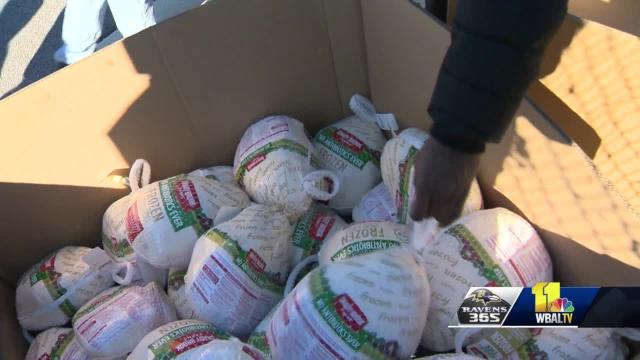 Ravens players hand out Thanksgiving food to Baltimore families