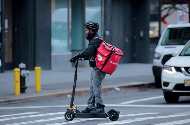A food delivery messenger is seen in Manhattan. (Luiz C. Ribeiro/New York Daily News/Tribune News Service via Getty Images)