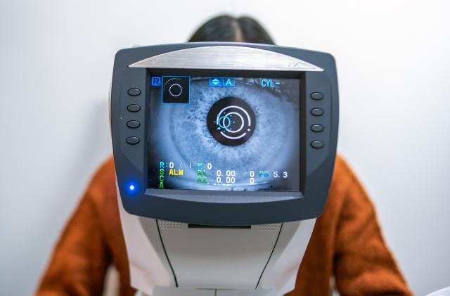 A Women having an eye exam at ophthalmologist's office.