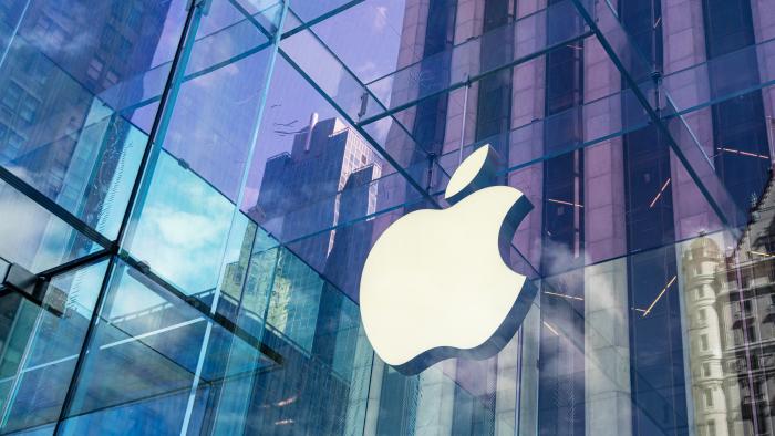 New York City, United States - September 27, 2016: Glass building of the Apple Store with huge Apple Logo at 5th Avenue near Central Park. The store is designed as the exterior glass box above the underground display room